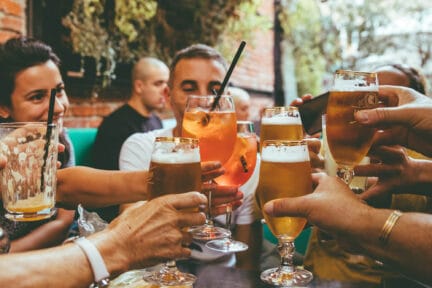 People cheering in a beer garden